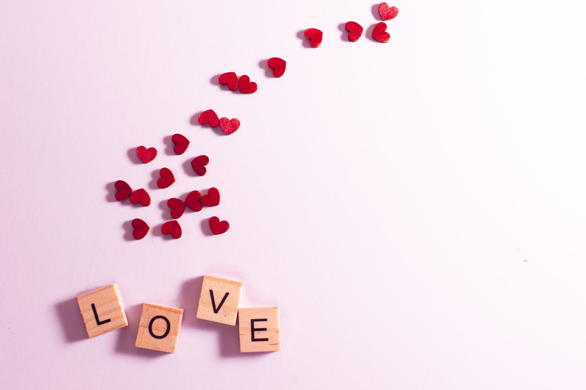 wooden cubes and hearts on a desk