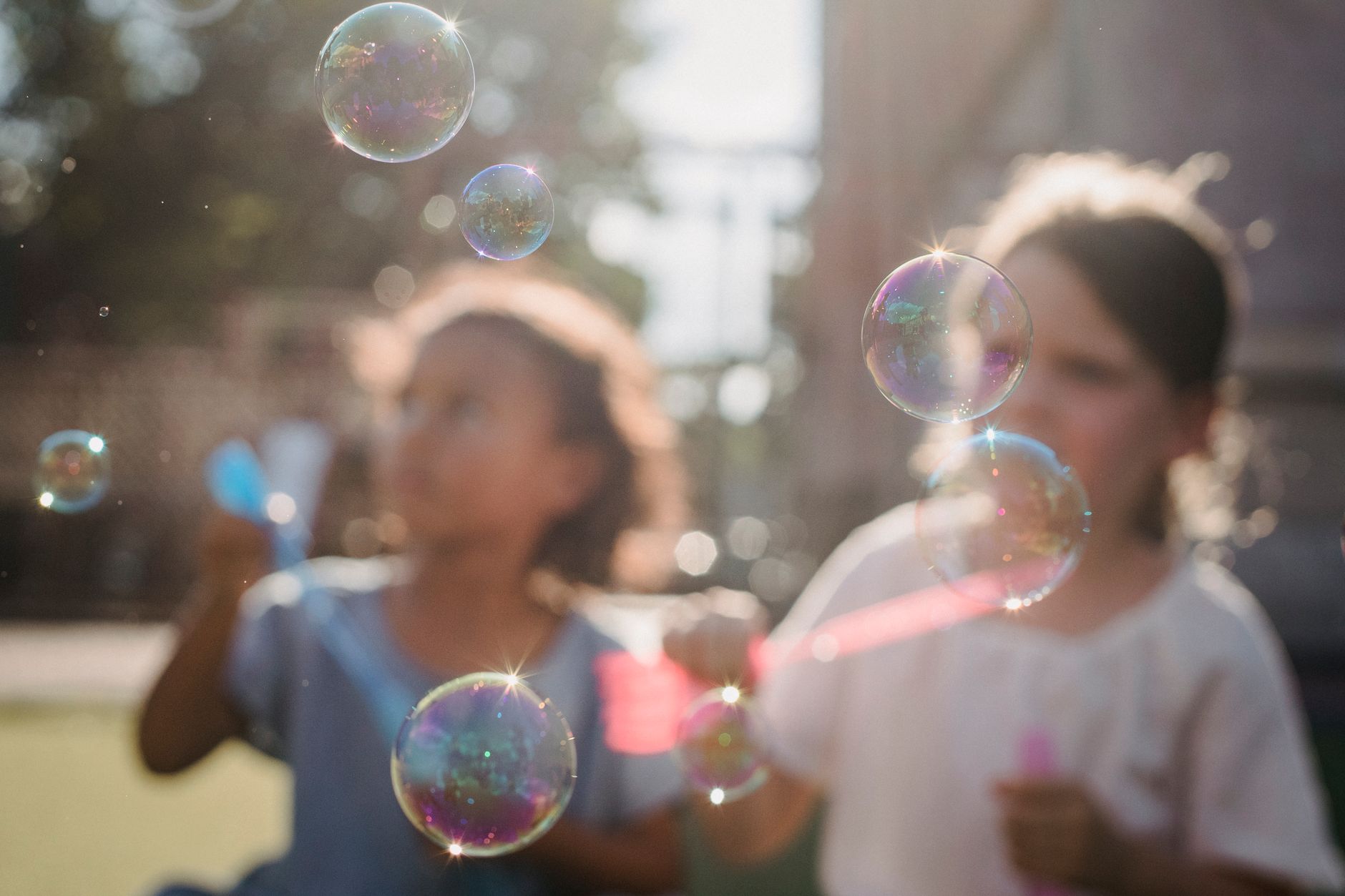 girls blowing bubbles